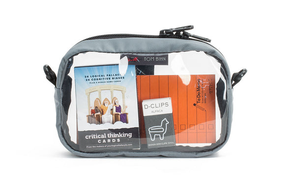 A Cloud light grey 3D Clear Organizer Cube filled with sundries.